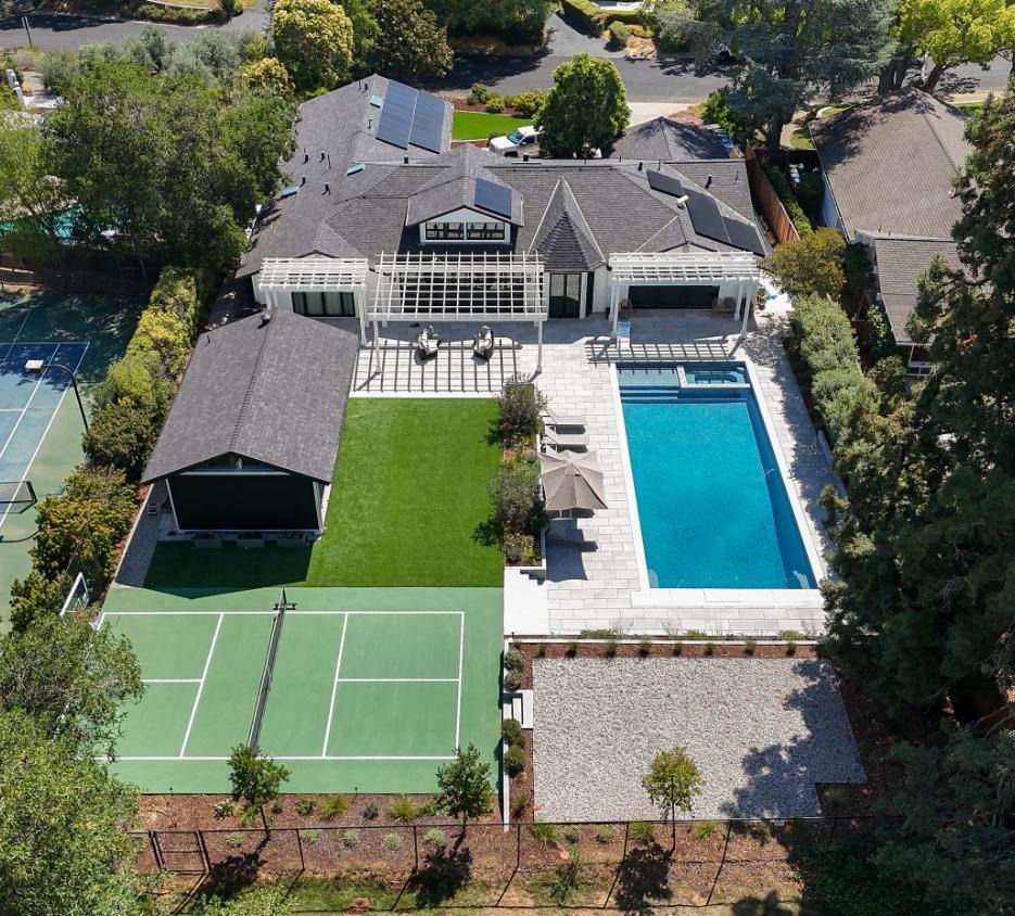 Aerial view of luxury residential estate with pool, tennis court, outdoor living areas, and professionally designed landscape by K&D Landscaping