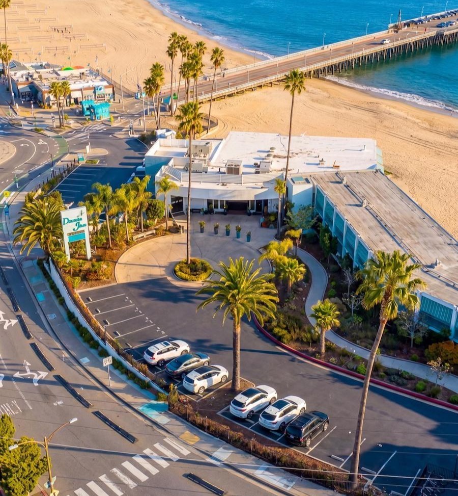 Aerial view of coastal hospitality property with professionally maintained landscape by K&D Landscaping Aerial view of coastal hospitality property with professionally maintained landscape by K&D Landscaping