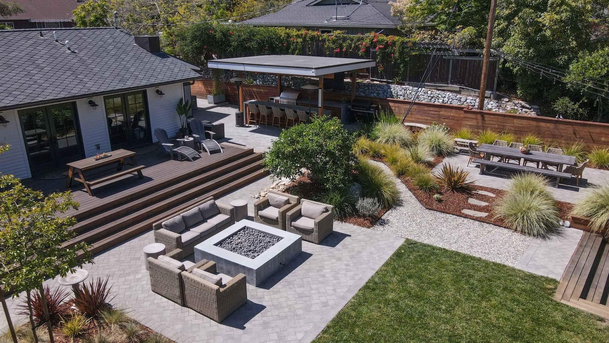 Custom paver patio and poolscape designed for residential outdoor living by K&D Landscaping