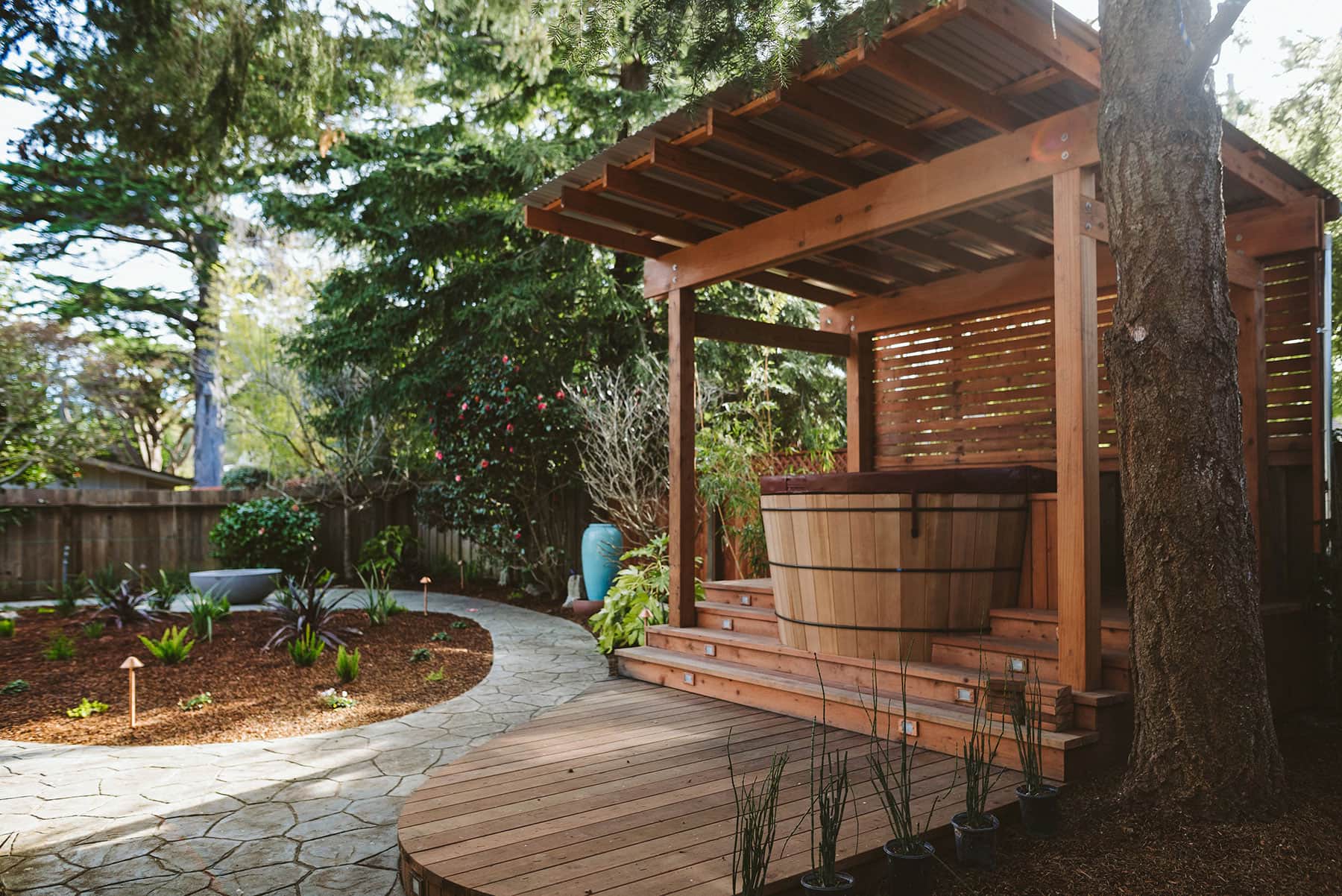Backyard wooden hot-tub and paver patio by K&D Landscaping Backyard wooden hot-tub and paver patio by K&D Landscaping