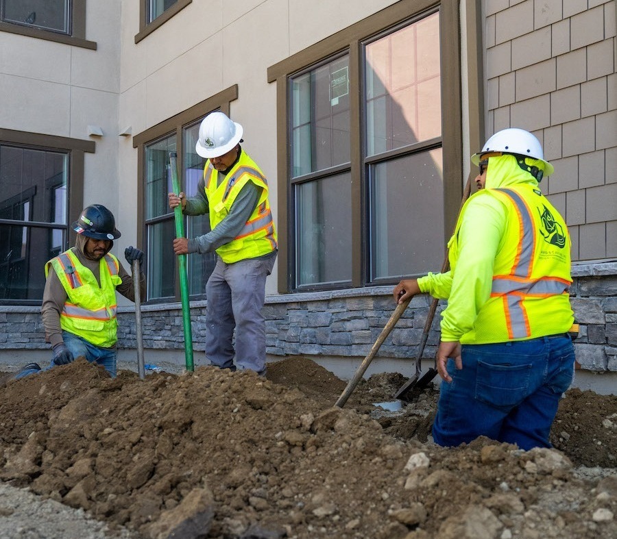 K&D Landscaping employees working together to maintain high standards across client properties K&D Landscaping employees working together to maintain high standards across client properties
