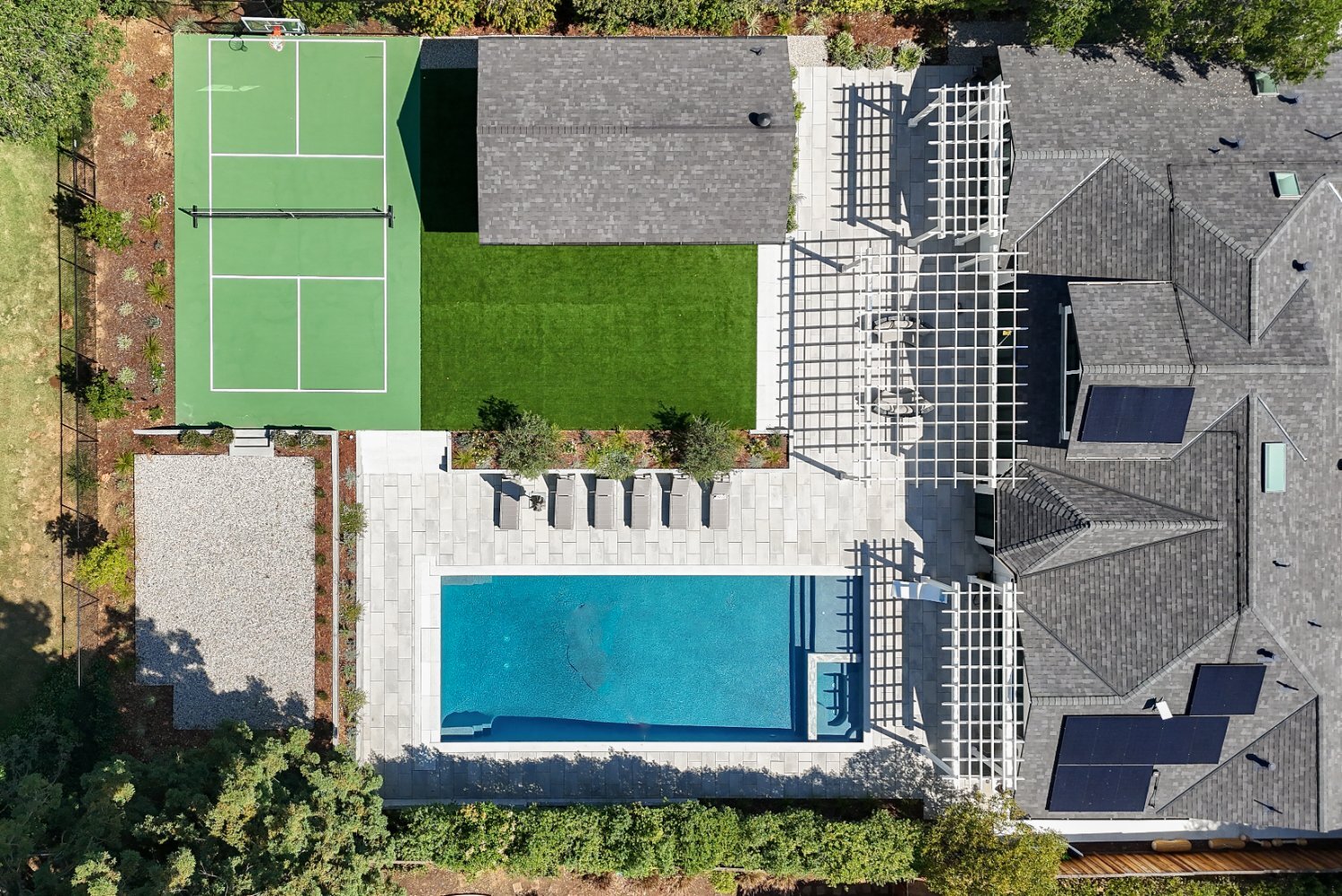 Residential outdoor living project featuring complex grading and drainage solutions by K&D Landscaping