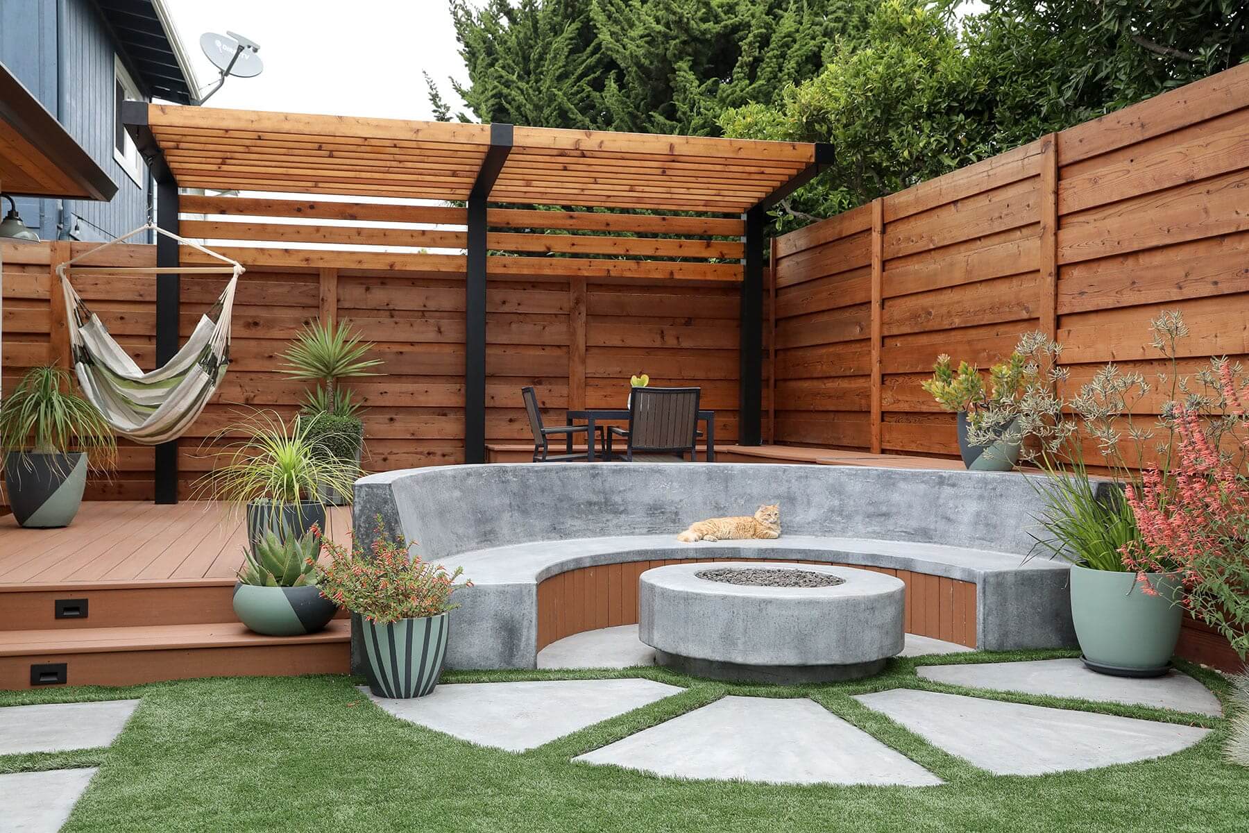 Custom backyard landscape with professionally installed plantings by K&D Landscaping