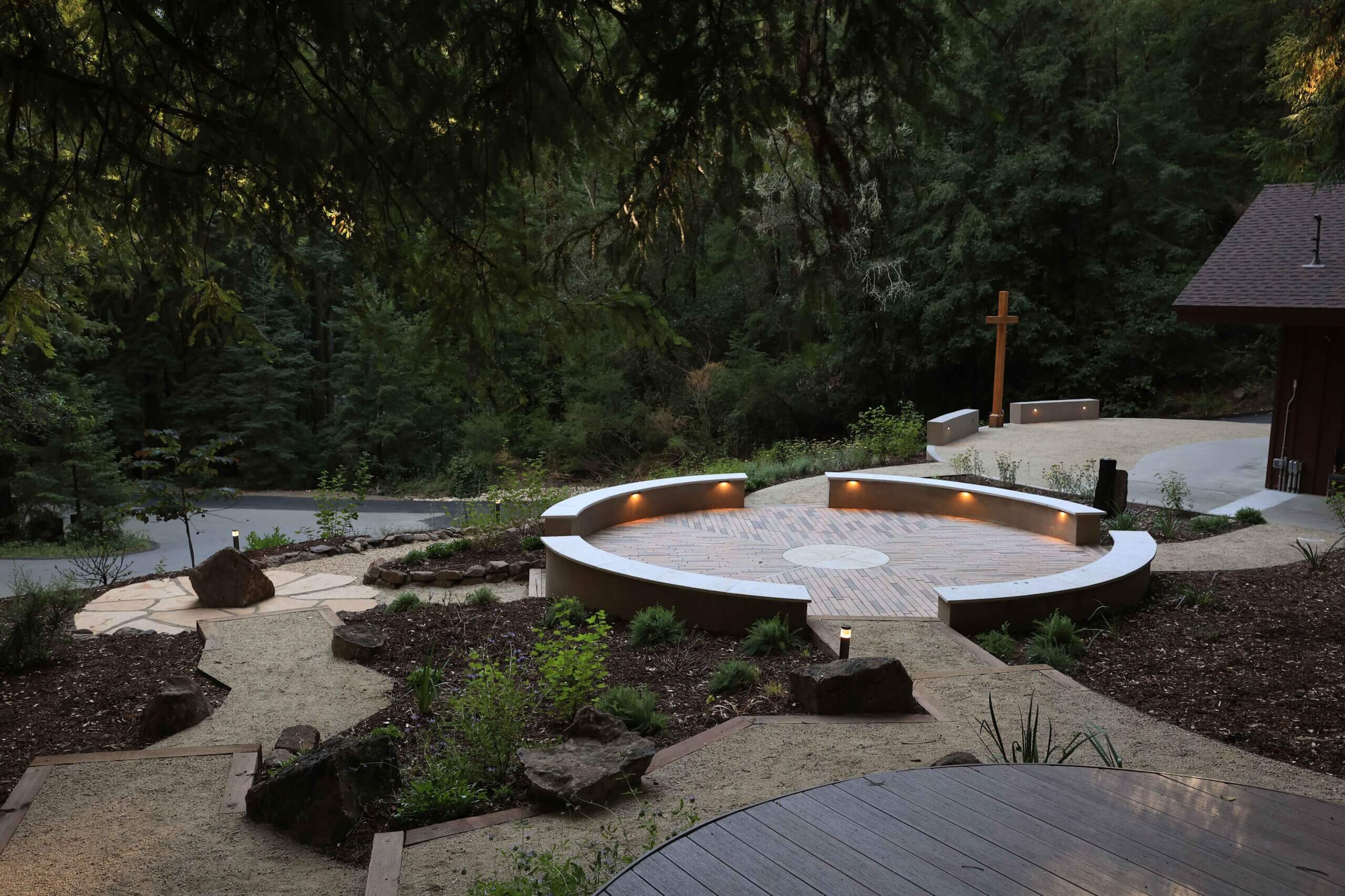 Amphitheater-style outdoor seating area integrated into a natural landscape by K&D Landscaping