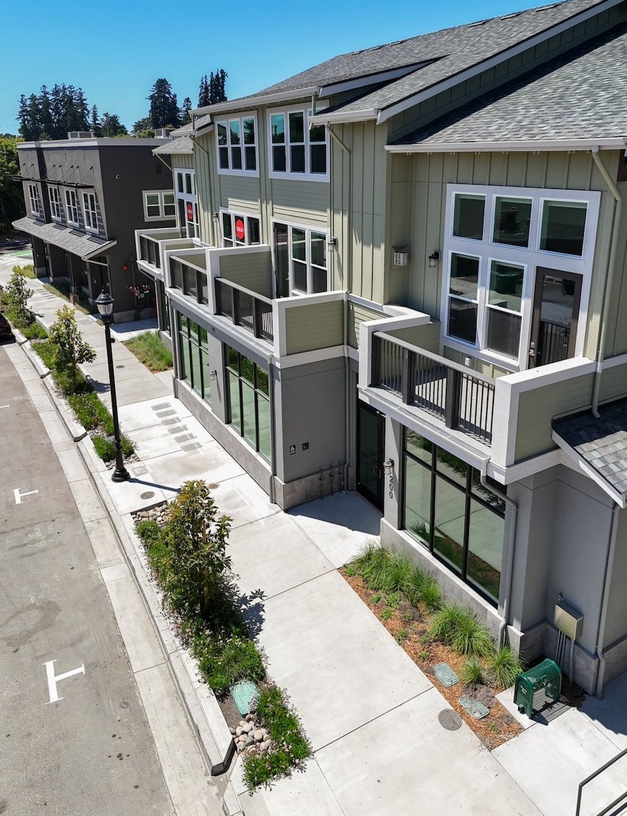 Apartment community exterior enhanced with landscape construction and irrigation by K&D Landscaping