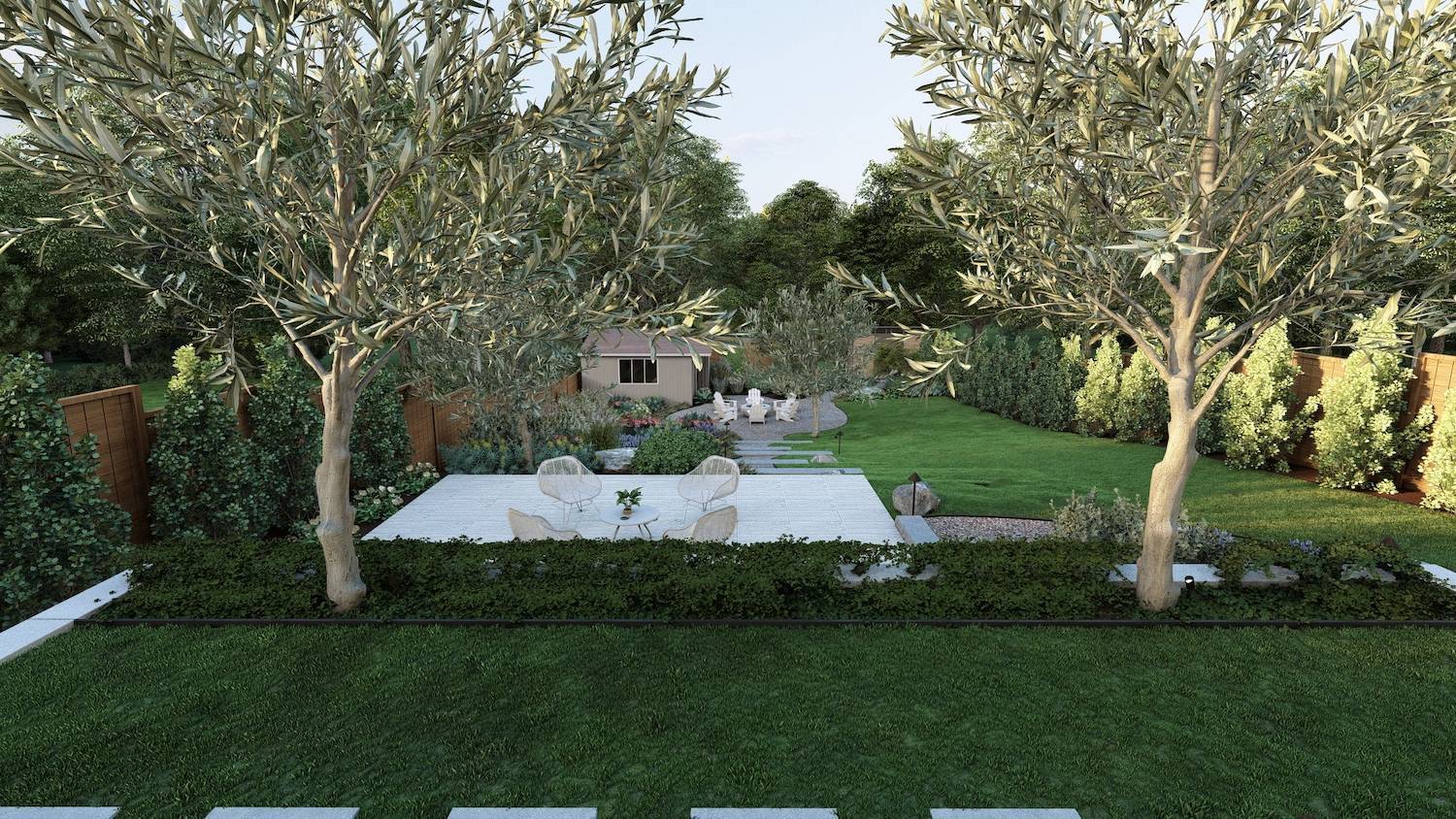 Backyard landscape by K&D Landscaping featuring olive trees, a spacious lawn, layered planting beds, and a private patio seating area