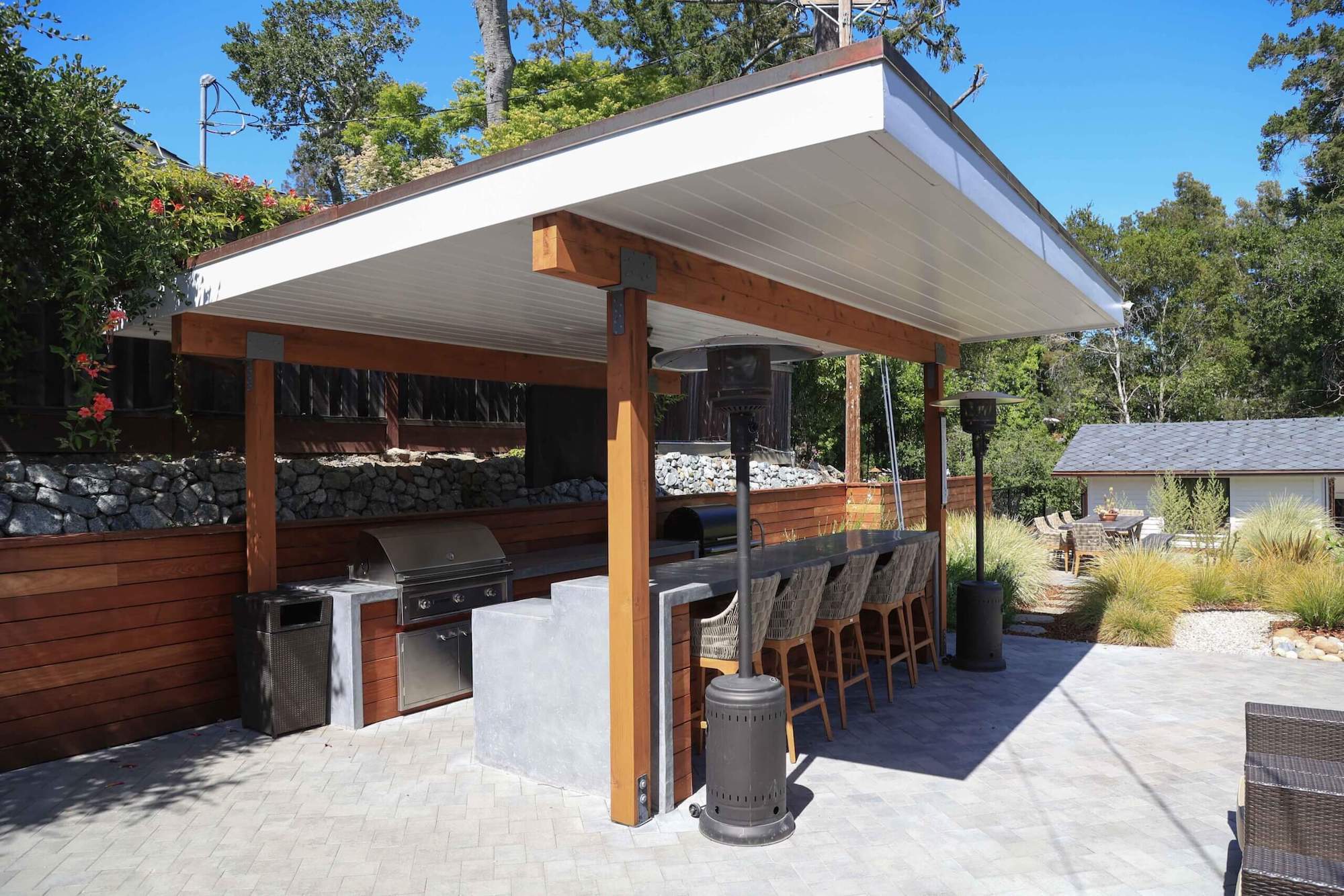 Backyard transformation with integrated landscape and outdoor living elements by K&D Landscaping