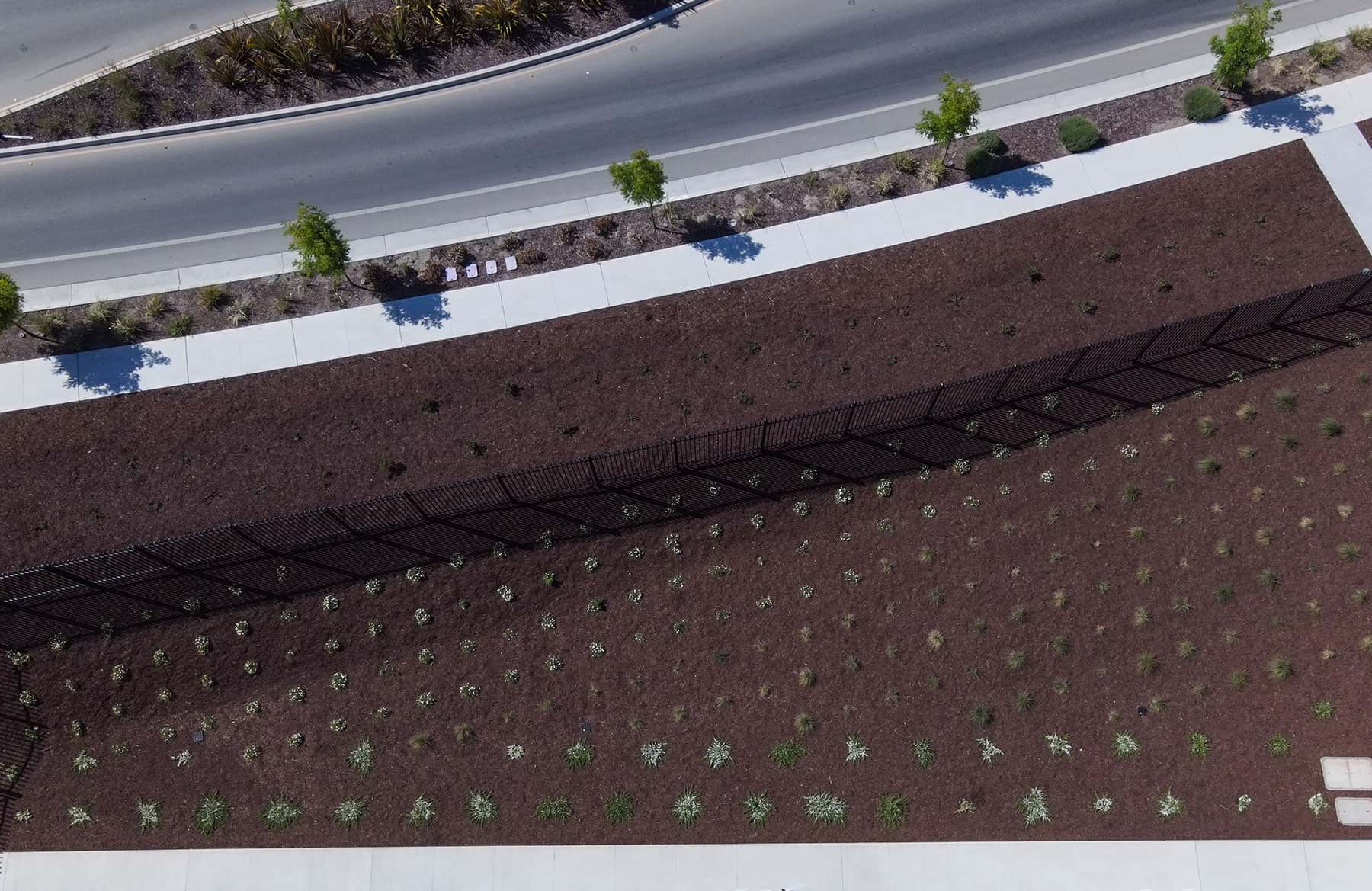 Campus grounds featuring decomposed granite and planting installations by K&D Landscaping