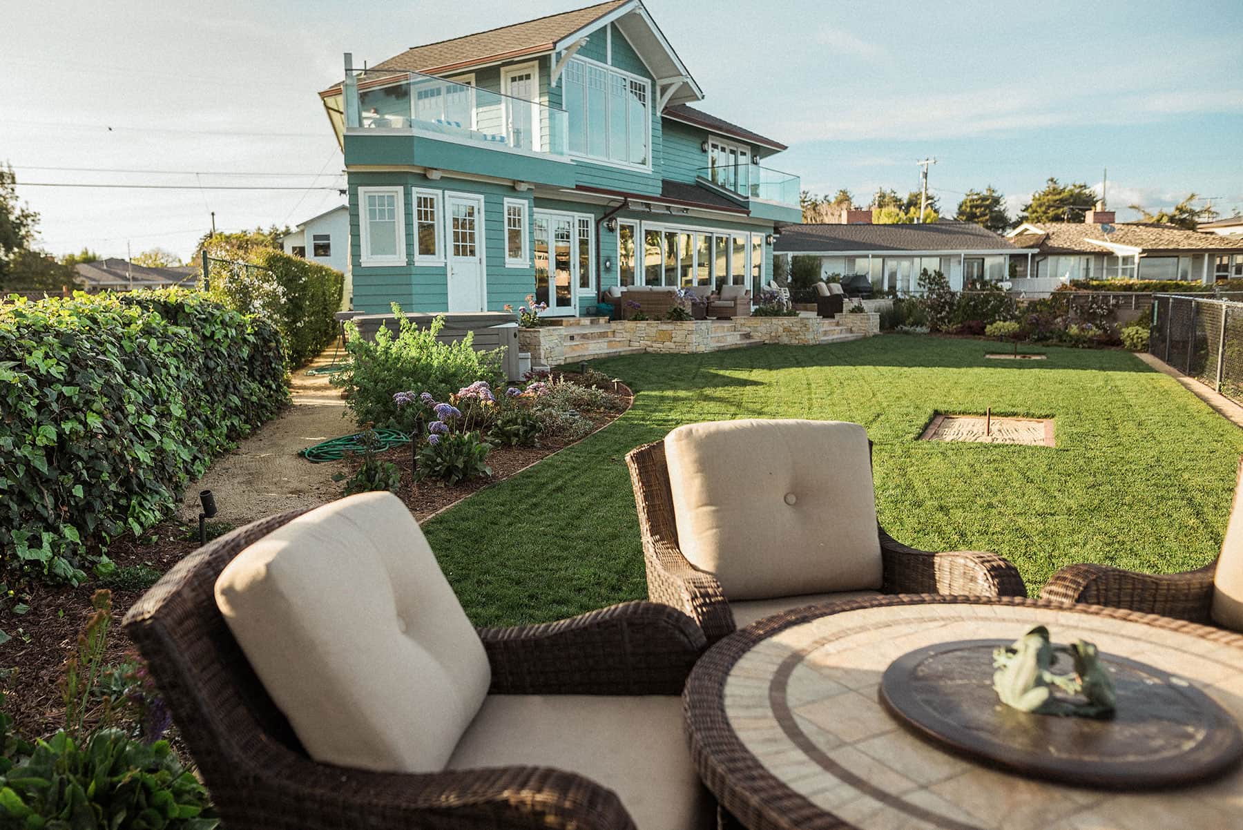 Coastal property landscape with purple asters, lawn & ocean view completed by K&D Landscaping 2