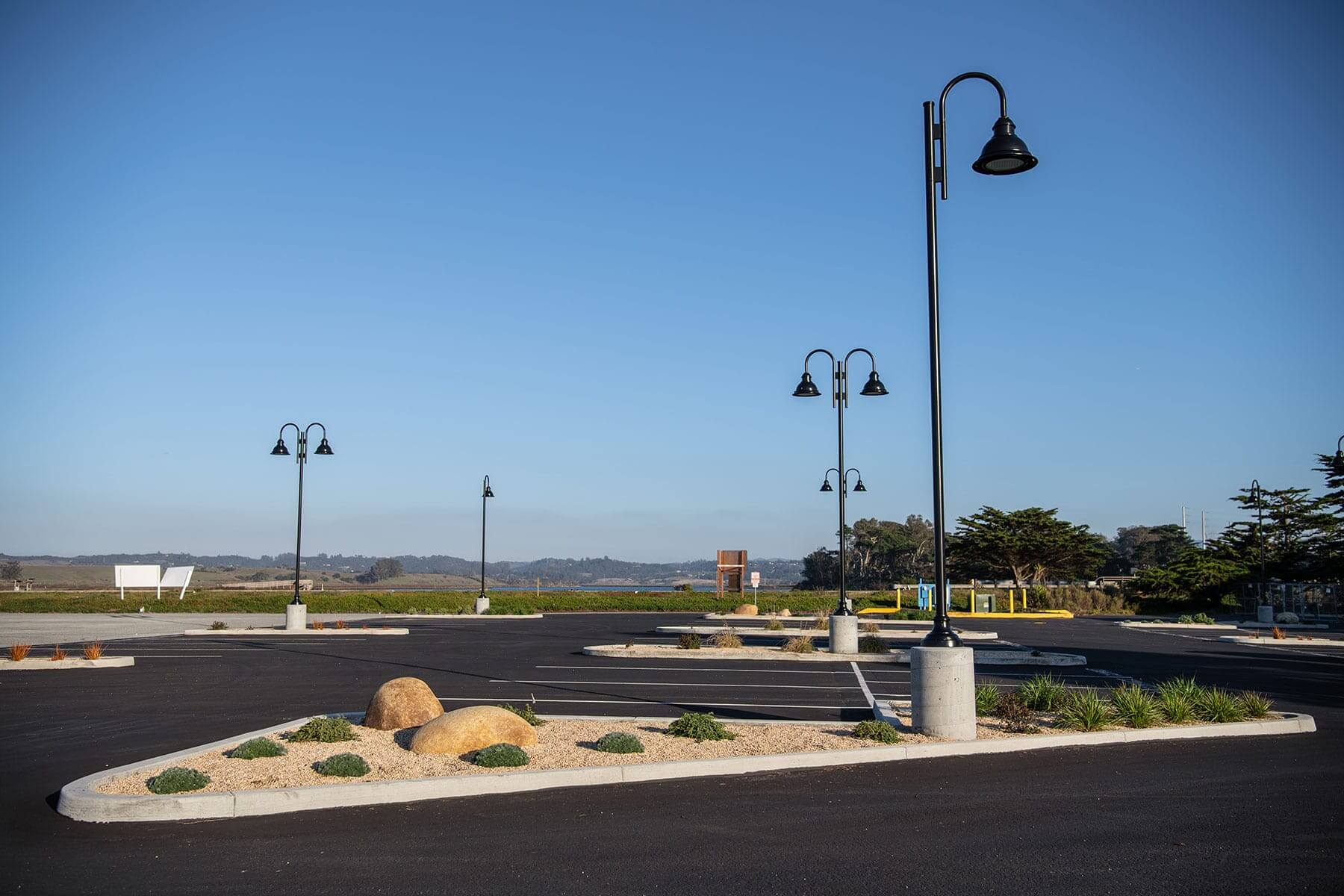 Commercial building frontage with accessible parking, landscape improvements, and drought-tolerant planting by K&D Landscaping