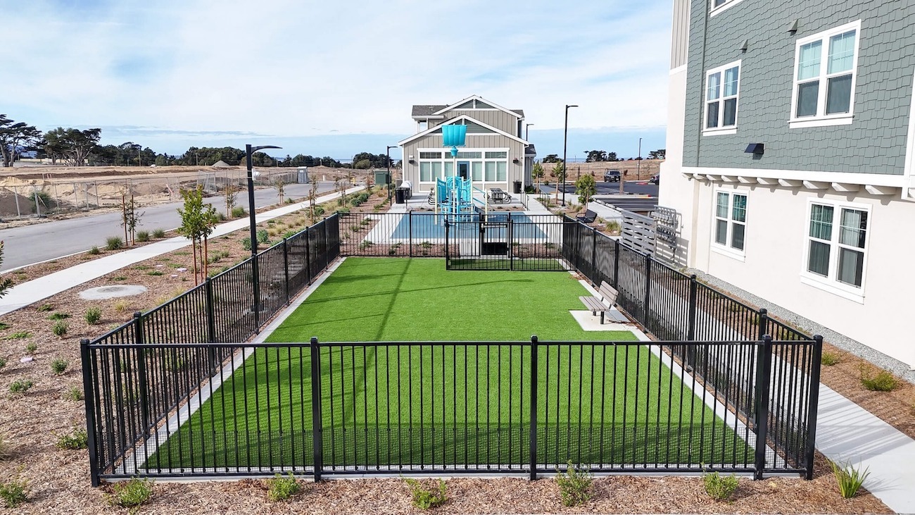 Commercial community landscape construction featuring recreational amenities, artificial turf, and outdoor gathering spaces by K&D Landscaping