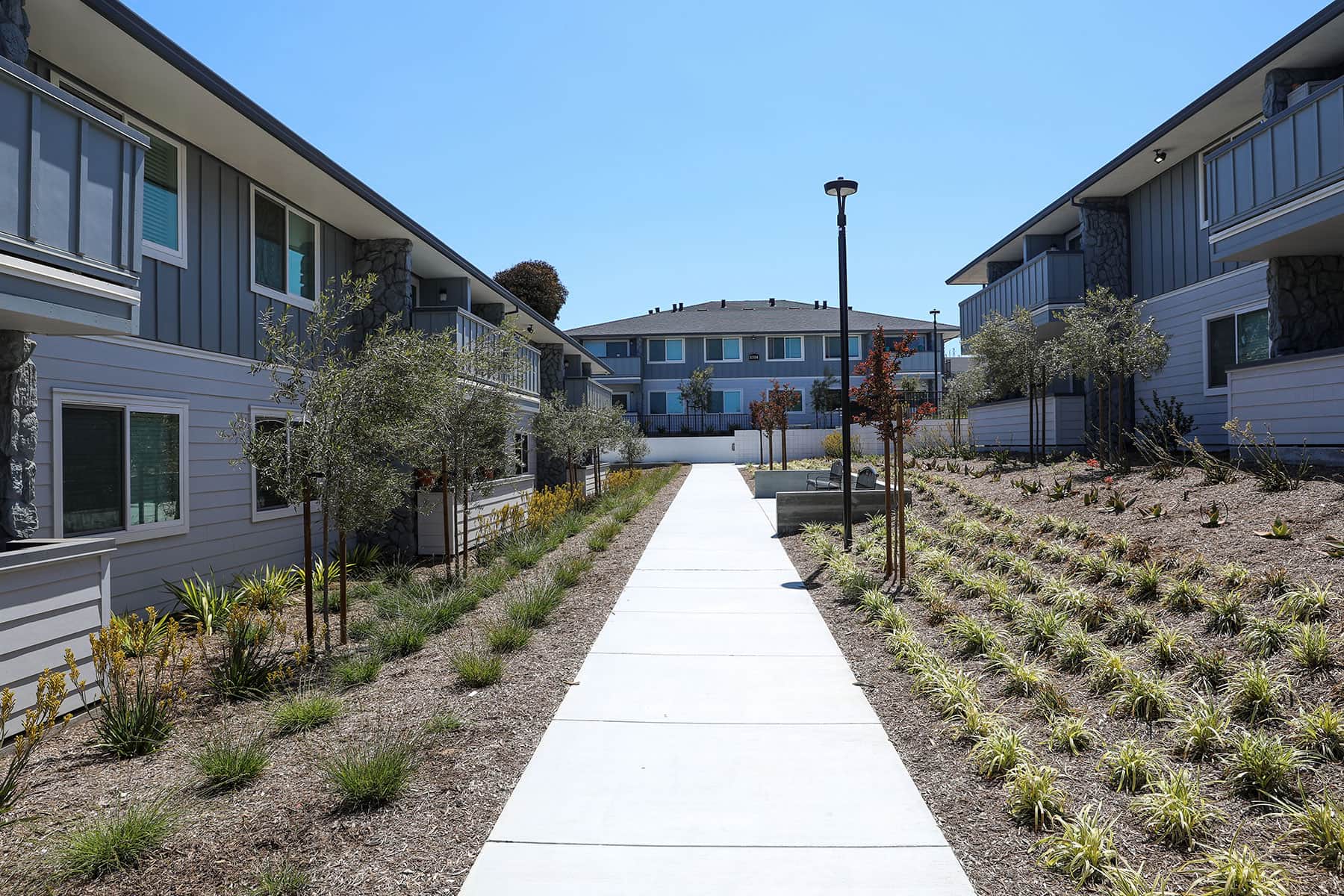 Commercial landscape installation with mulch and planting beds by K&D Landscaping