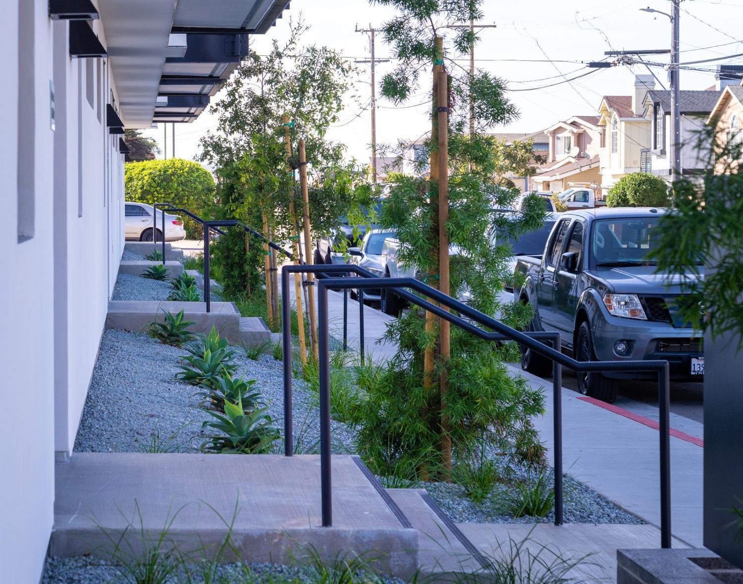 Commercial property landscape featuring mulch groundcover and ornamental plantings by K&D Landscaping