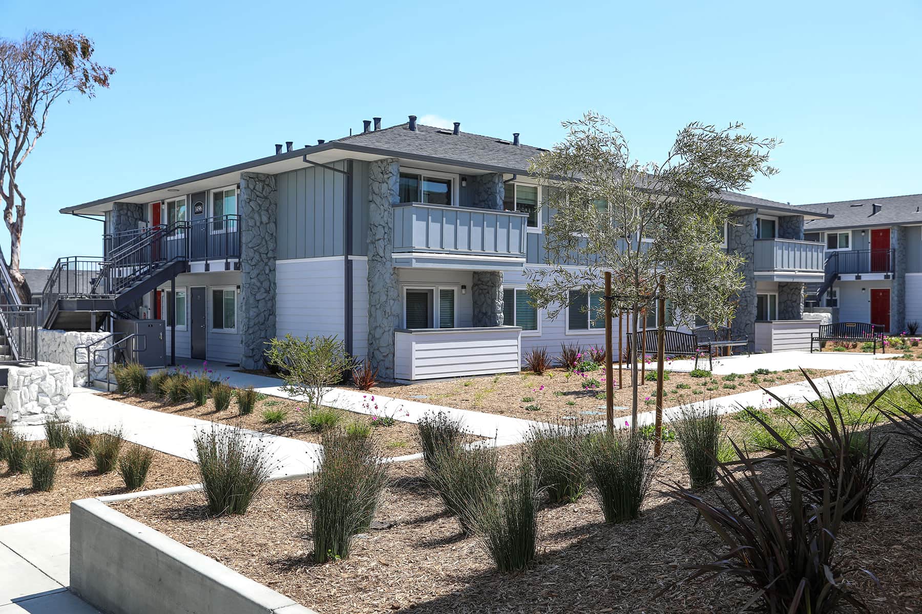 Community outdoor space featuring landscape improvements by K&D Landscaping