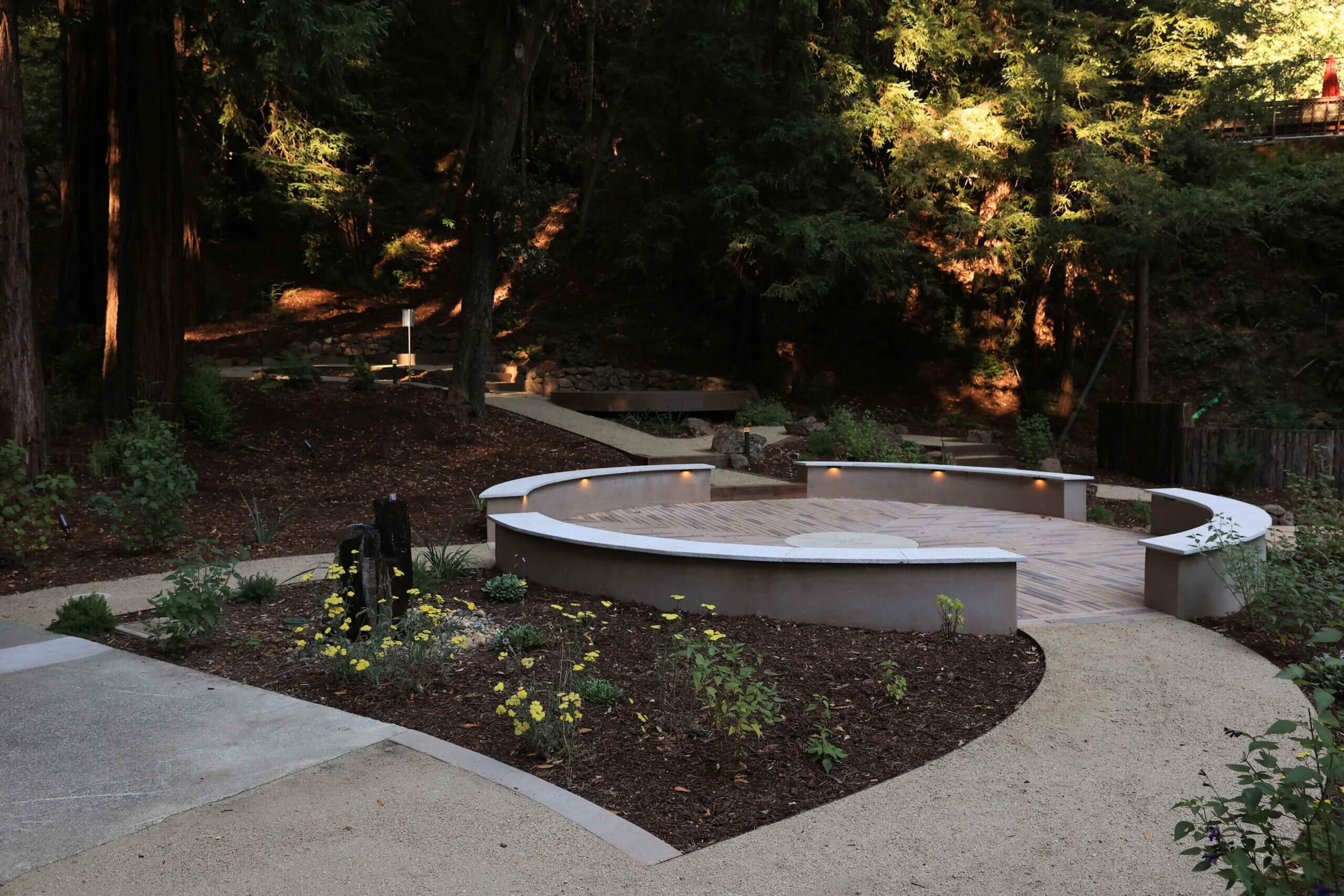 Concrete seating area designed for outdoor events and group gatherings by K&D Landscaping