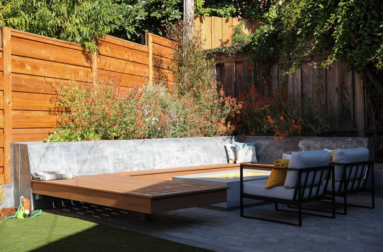 Concrete stepping stone pathway through a residential landscape by K&D Landscaping