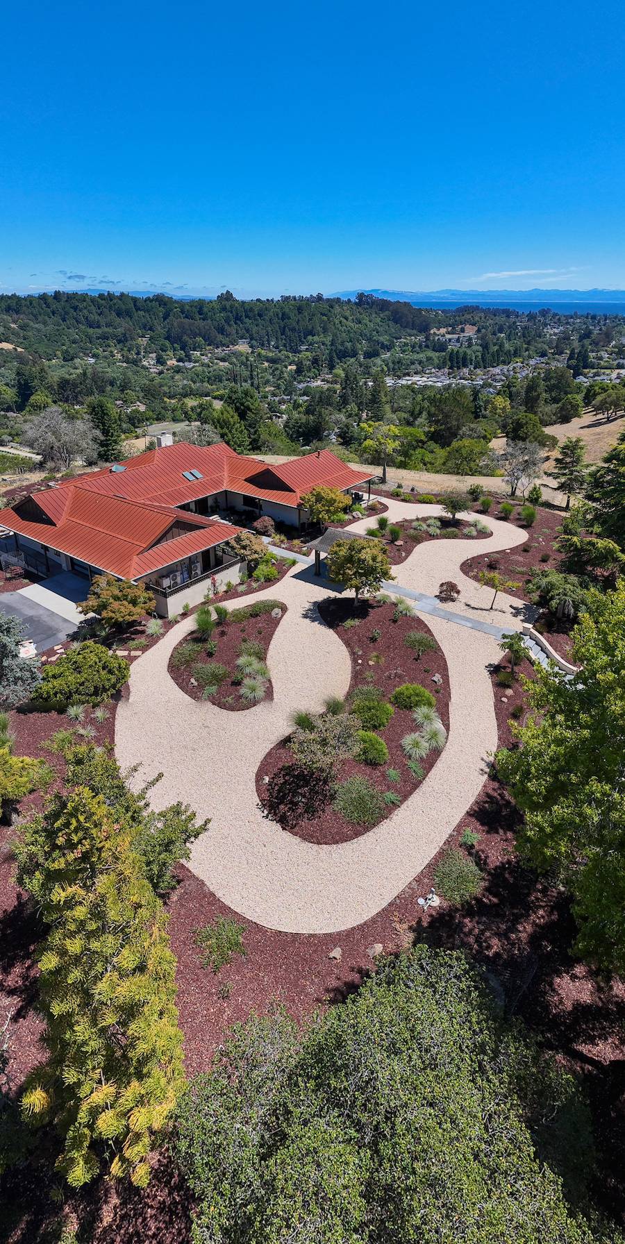 Contemporary residential backyard with an outdoor living space by K&D Landscaping