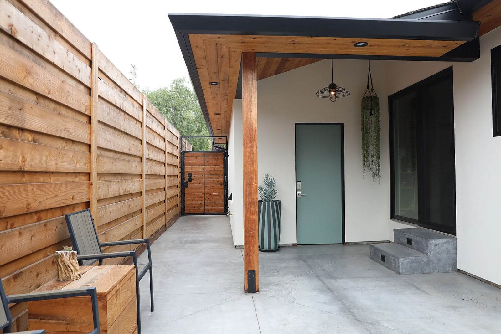 Custom bike washing station and outdoor shower wall by K&D Landscaping