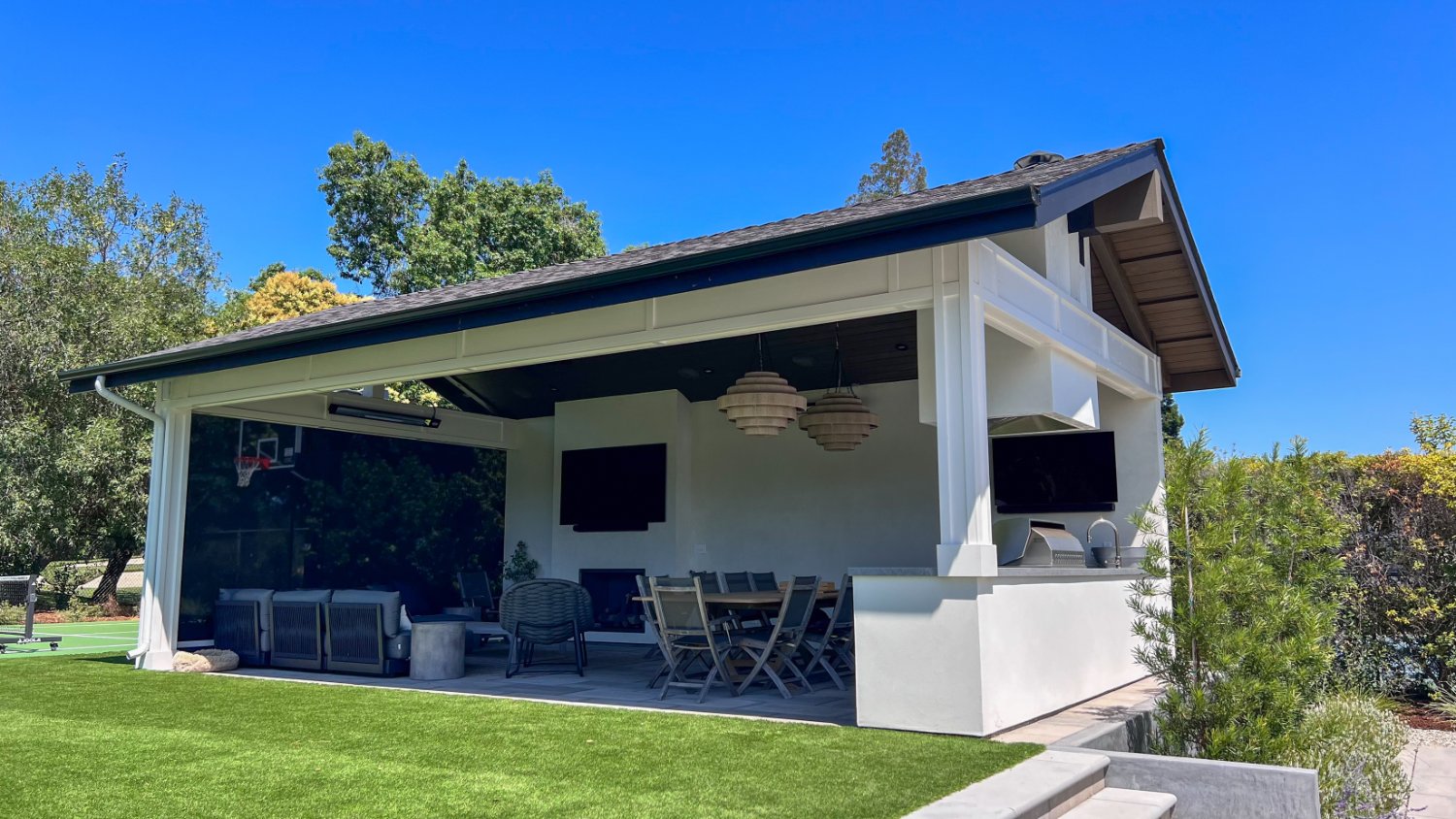 Custom hardscape installation supporting a large outdoor living environment by K&D Landscaping