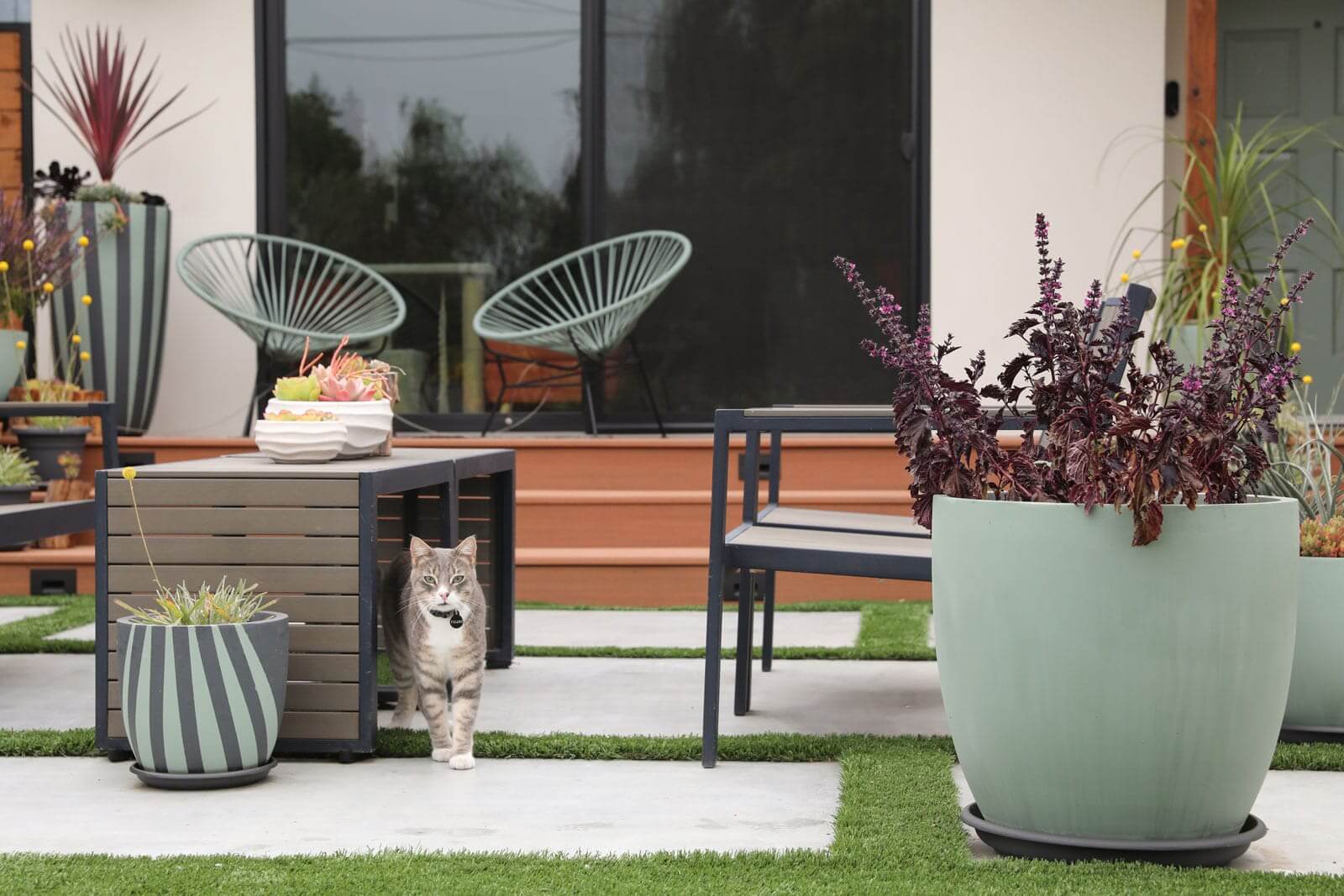 Custom poured-in-place fire pit within a sustainable landscape design by K&D Landscaping