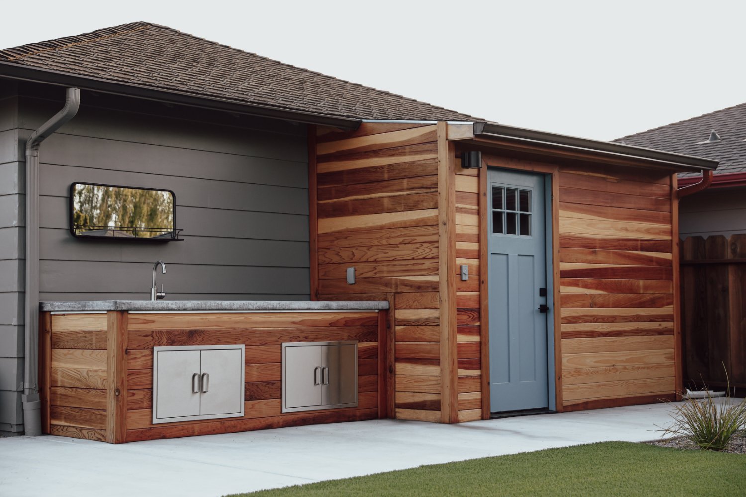 Custom shed integrated into a backyard wellness and garden environment by K&D Landscaping