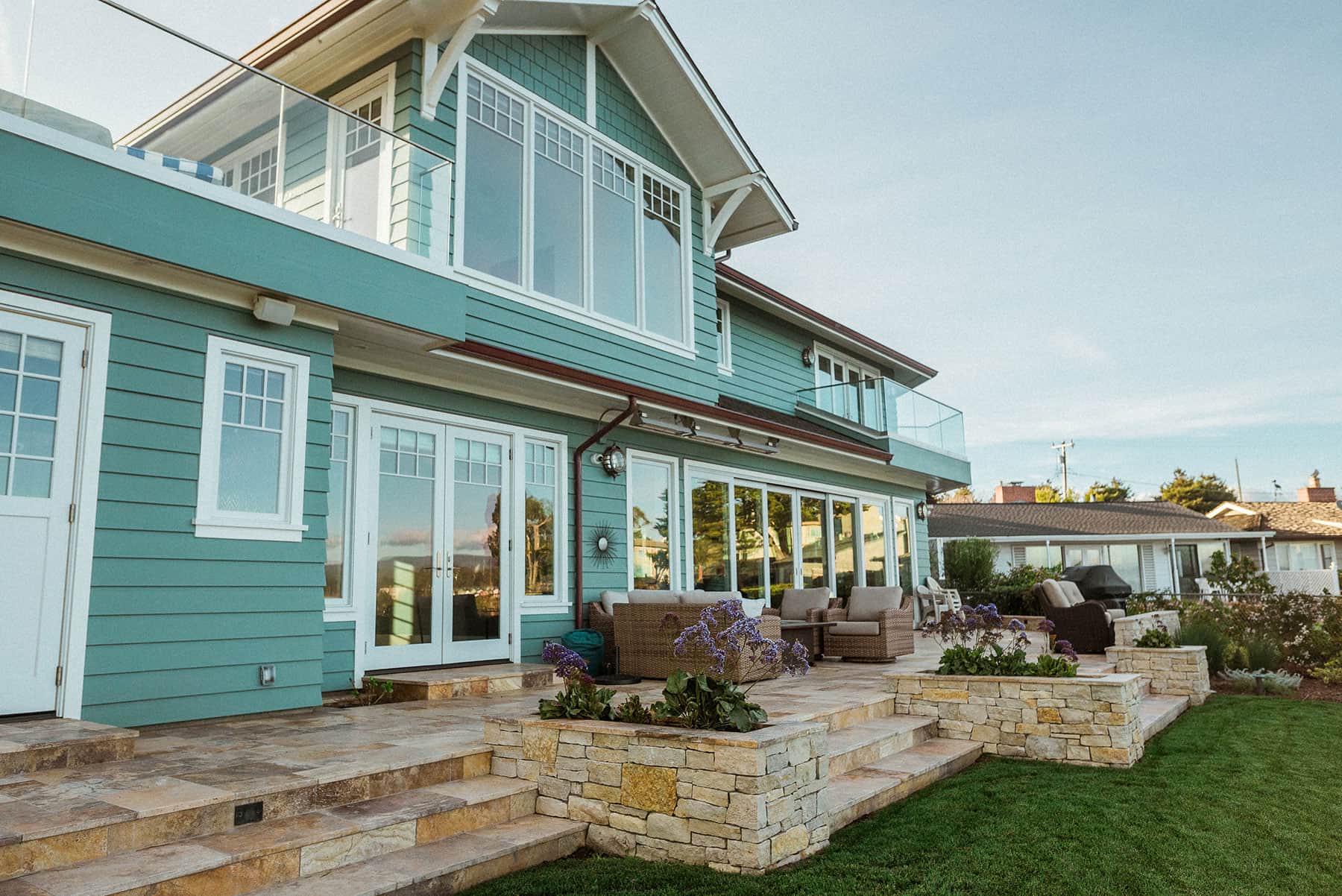 Custom residential landscape featuring integrated hardscape and plantings by K&D Landscaping