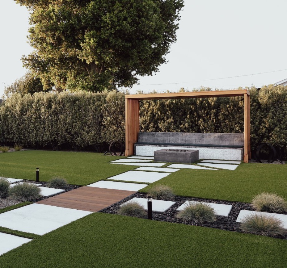 Decorative concrete pathway connecting wellness and garden features by K&D Landscaping