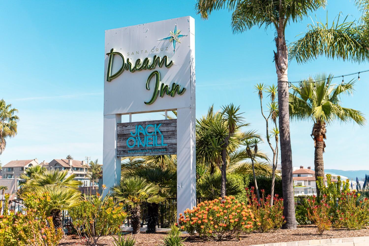 Dream Inn monument sign surrounded by coastal landscape plantings maintained by K&D Landscaping