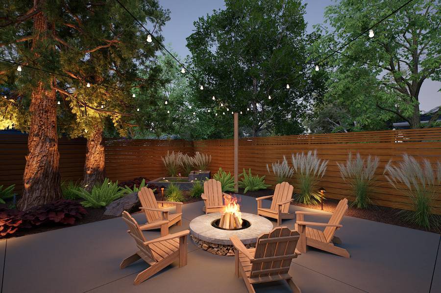 Evening outdoor living space by K&D Landscaping featuring a circular fire pit, Adirondack chairs, landscape lighting, and wood privacy fencing