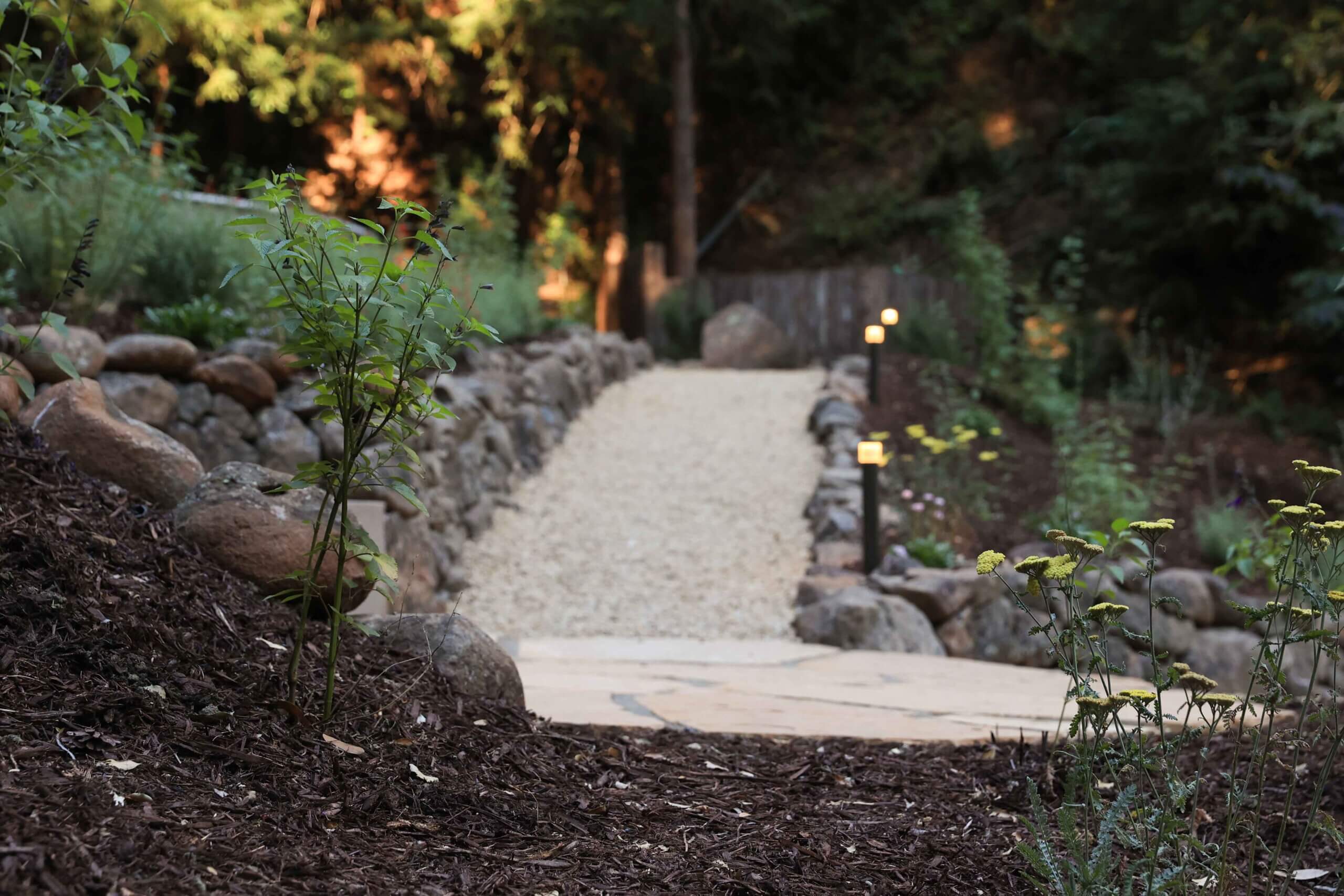 Flagstone patio and outdoor gathering space at a camp and conference center by K&D Landscaping
