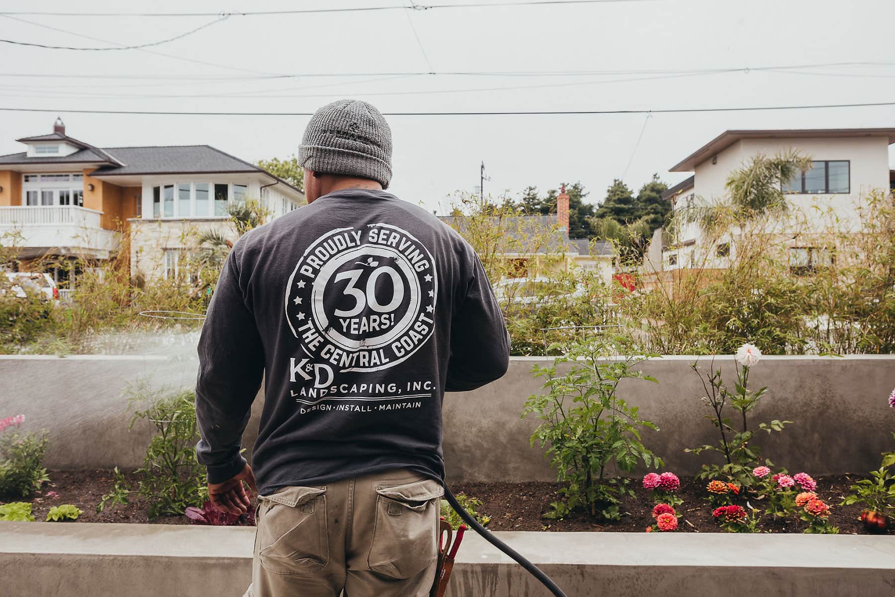 K&D Landscaping professional installing modern landscape with living wall and coastal retaining wall construction in Santa Cruz