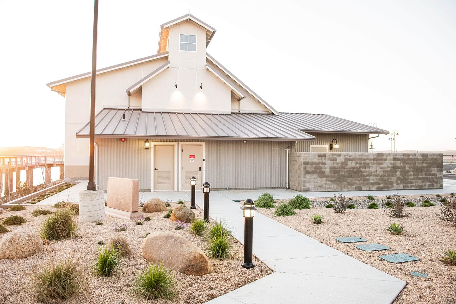 Commercial facility exterior with architectural landscaping, parking improvements, and site planting by K&D Landscaping