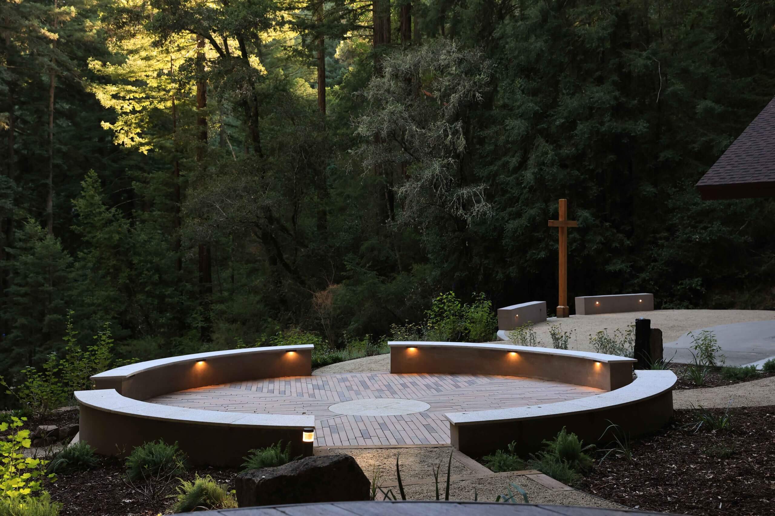 Landscape construction project featuring natural stone pathways and woodland surroundings by K&D Landscaping