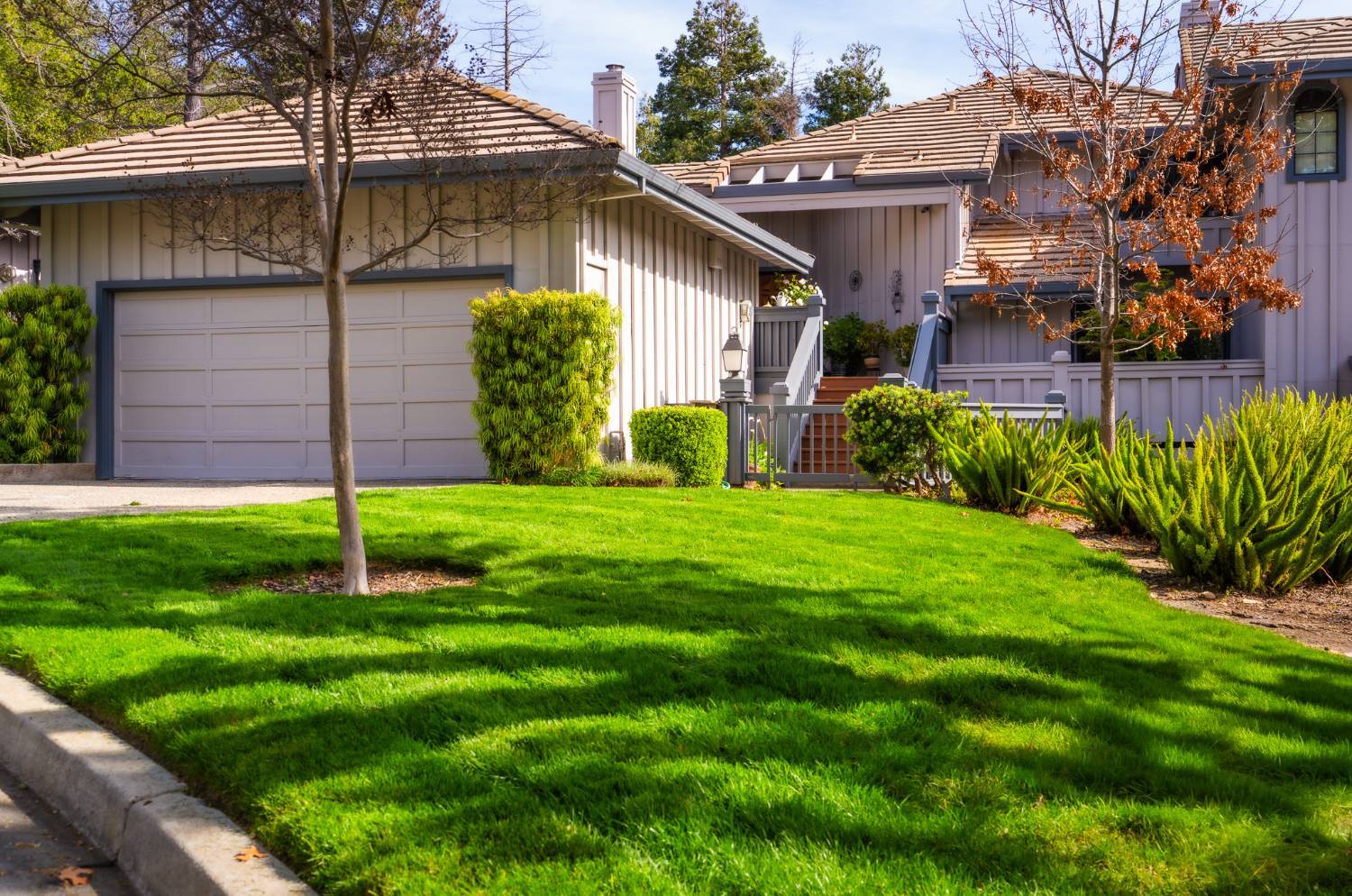 Large residential landscape maintained by K&D Landscaping with coordinated planting design