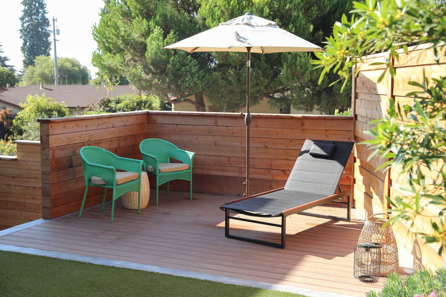Low-voltage landscape lighting illuminating a residential outdoor living area by K&D Landscaping