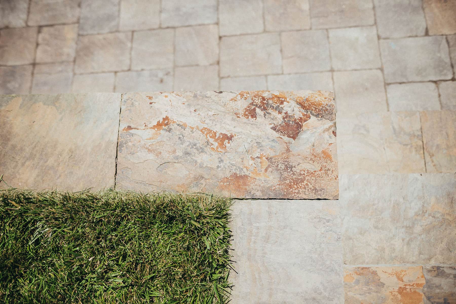 Natural stone paver detail showing textured surface and refined craftsmanship from K&D Landscaping curb appeal work