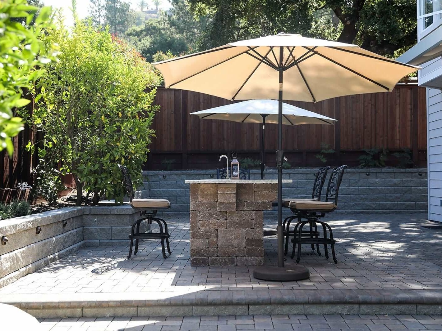 Outdoor kitchen and patio designed for year-round entertaining by K&D Landscaping
