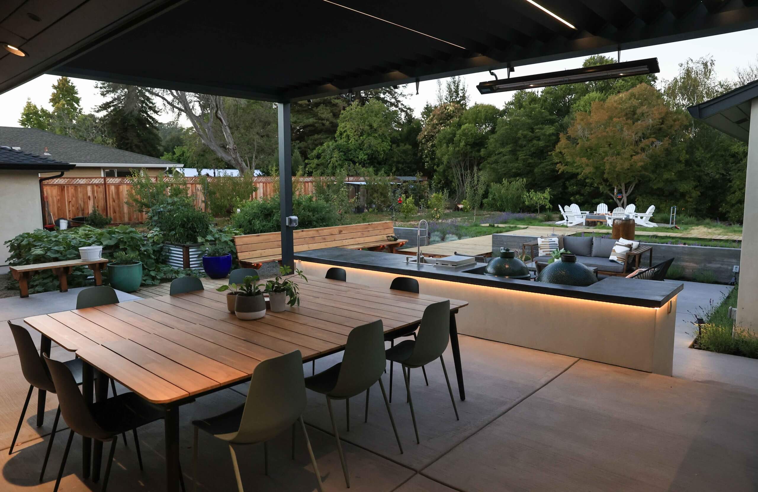 Outdoor living area featuring custom paving and landscape enhancements by K&D Landscaping