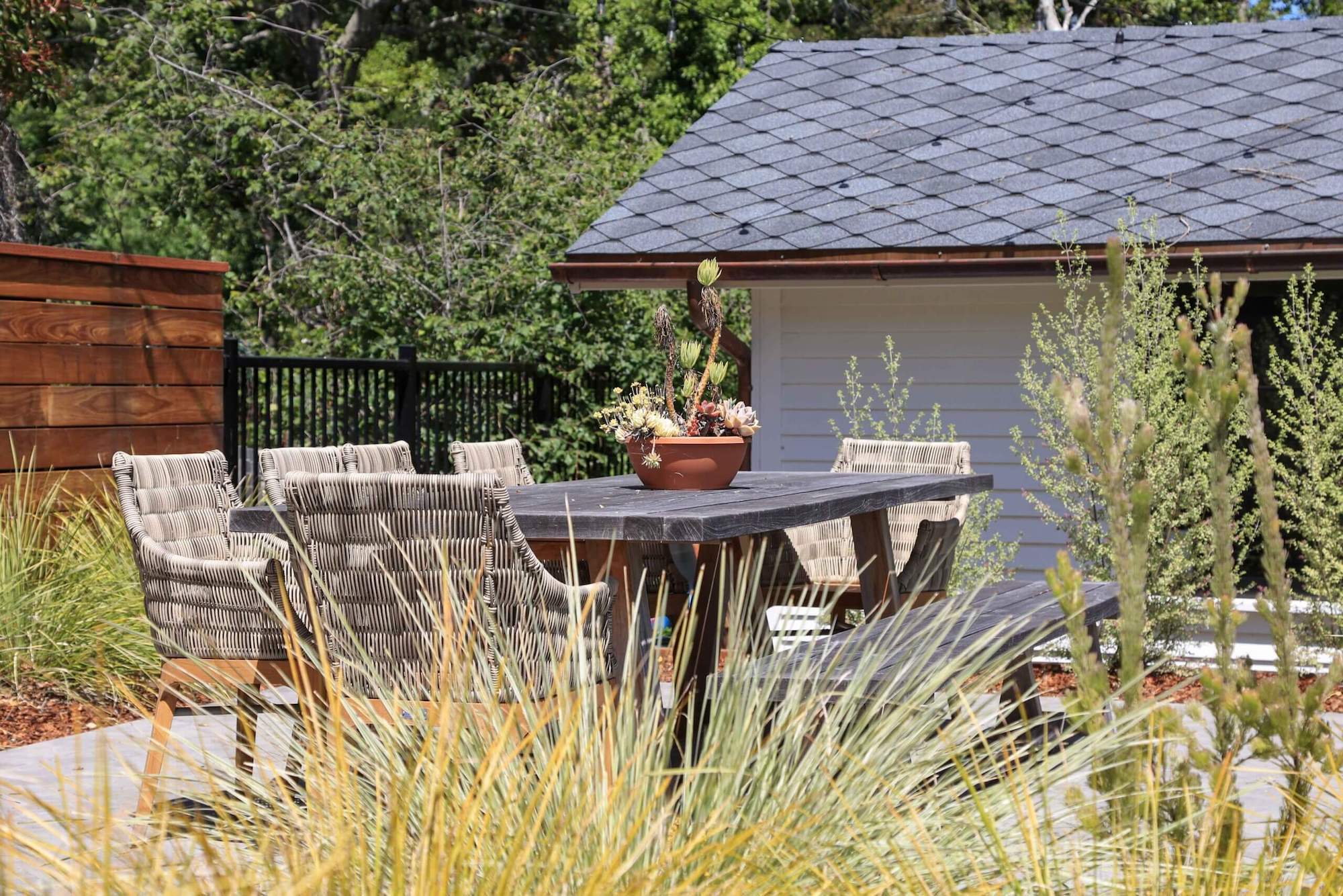 Poolside landscape design with coordinated hardscape and planting plan by K&D Landscaping