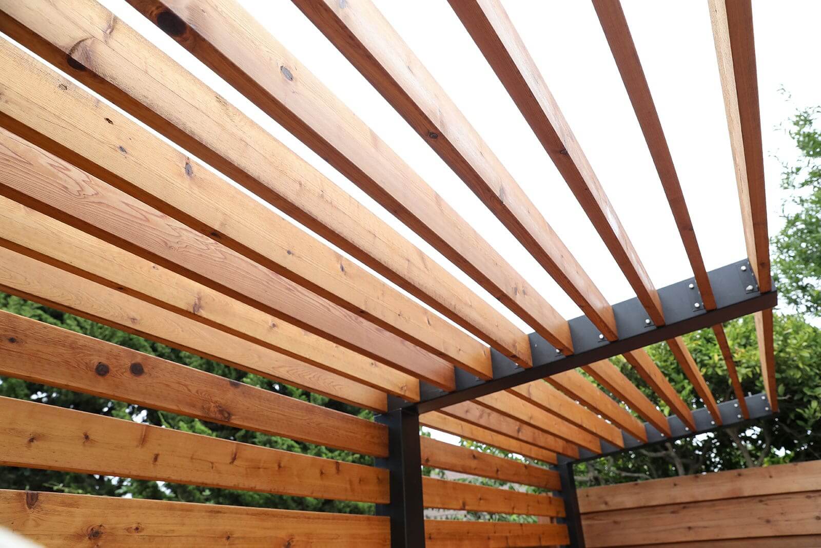 Redwood privacy fencing and modern residential landscape by K&D Landscaping