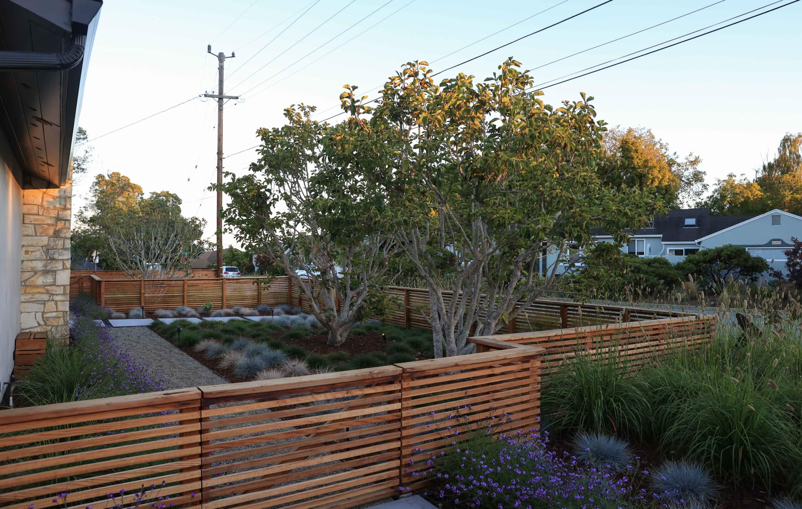 Residential backyard retreat with custom landscape design and outdoor living features by K&D Landscaping