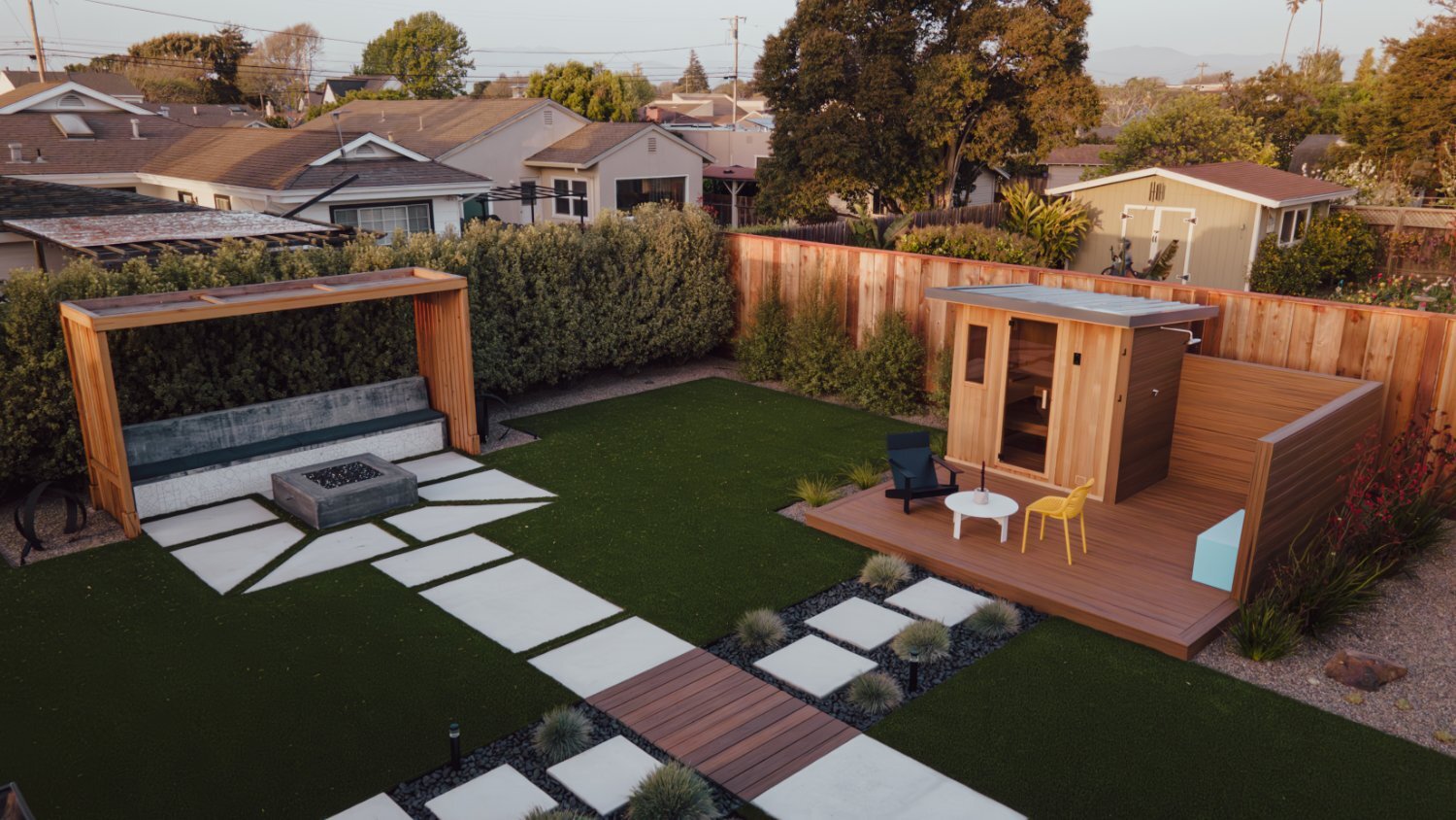 Residential landscape with integrated storage gardening and outdoor living features by K&D Landscaping