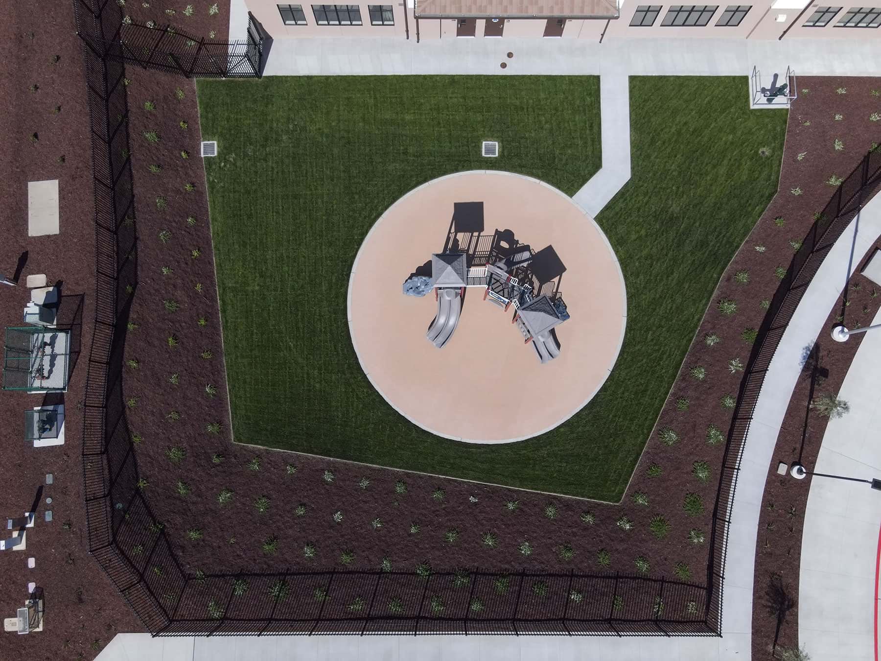 School playground area bordered by landscape improvements by K&D Landscaping