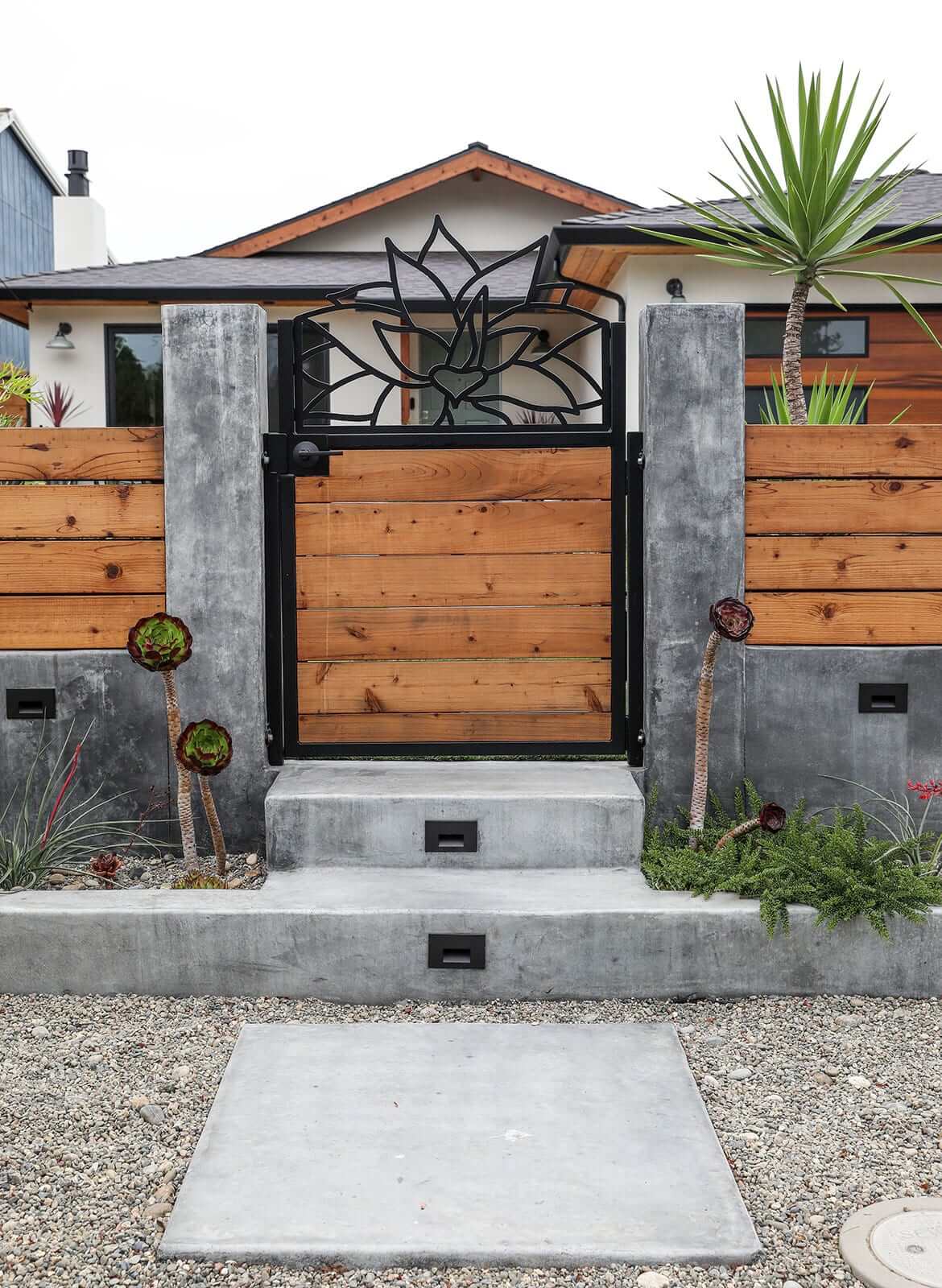 TimberTech deck and custom outdoor gathering area by K&D Landscaping
